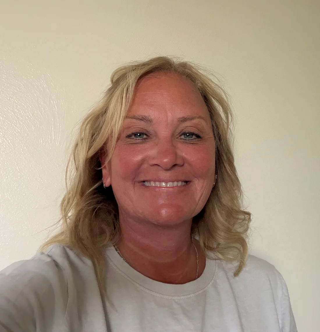 Jen Flowers, Certified Mastectomy Fitter at Carol's, smiling warmly